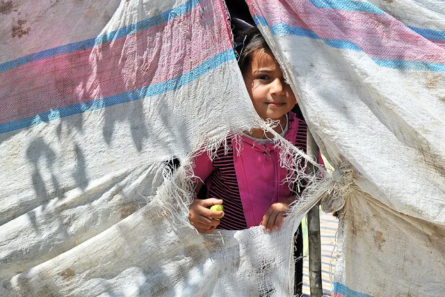 Syrian refugee girl. Credit: thomas koch via Shutterstock.