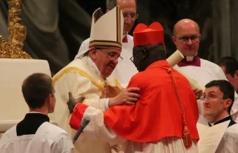 Pope Francis embraces a new cardinal at the Feb. 22 consistory, February 22, 2014. Credit: Lauren Cater/CNA.