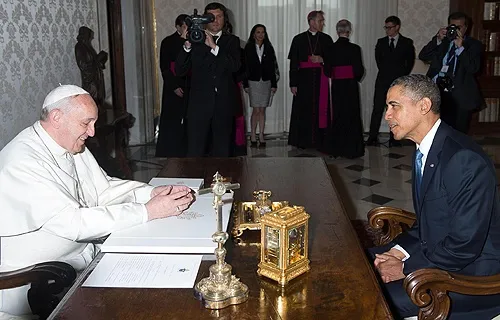 Pope Francis and US President Barack Obama speak during a private audience at athe Vatican, March 27, 2014. Credit: ANSA/OSSERVATORE ROMANO.