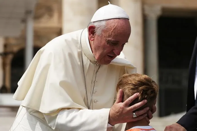 Pope Francis embraces a child at the general audience in St. Peter's square on Sept. 2, 2015. Credit: Daniel Ibáñez/CNA.