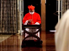 Cardinal Jose Advincula kneels to pray after entering the Manila Cathedral at the start of his installation as the 33rd archbishop of the Archdiocese of Manila on June 24, 2021.