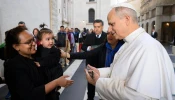 Nadia Howlader is given a key to a new apartment by Pope Leo XIV on Nov. 16 on the ninth World Day of the Poor.