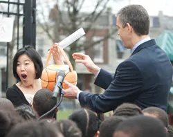 DC Public Schools Chancellor Michelle Rhee receives an Easter basket filled with 3,000 reserved tickets to the White House Easter Egg Roll from U.S. Education Secretary Arne Duncan?w=200&h=150