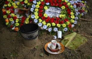 Flowers and offerings are placed at the grave of Ukya Chhaing Marma. The seventh-grader died from his wounds after being rescued from a July 21, 2025, plane crash at his Dhaka school. Credit: Piyas Biswas