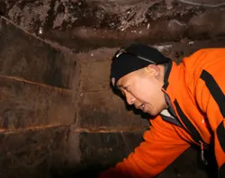 A Chinese explorer inside one of the wooden structures on Mt. Ararat. ?w=200&h=150