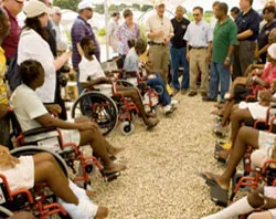 Supreme Knight Carl Anderson greets Haitian earthquake victims who received wheelchairs on April 27. ?w=200&h=150