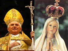 Pope Benedict and a statue of Our Lady of Fatima.