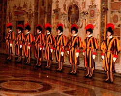 Swiss guards stand at the ready in the Vatican.?w=200&h=150