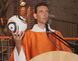 Fr. Paul Vlaar during the World Cup-themed Mass he presided over.?w=200&h=150