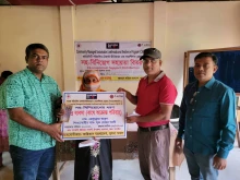 Tiger widow Zebunnesa Khatun, wife of late Mohor Ali, receives help from Caritas Khulna Region on Nov. 15, 2025.