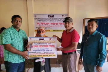 Tiger widow Zebunnesa Khatun, wife of late Mohor Ali, receives help from Caritas Khulna Region on Nov. 15, 2025.