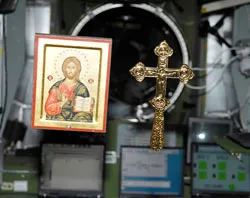 One of the icons and a cross floating in zero gravity on the ISS.  ?w=200&h=150