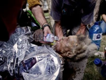 Enu Zizi being rehydrated after a week under the rubble of the cathedral. 