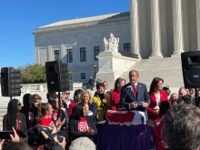 Texas Attorney General Ken Paxton speaks outside the Supreme Court following oral arguments on Nov. 1, 2021