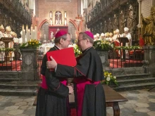 Archbishop Tadeusz Wojda of Gniezno, president of the Polish Bishops’ Conference (left), and Bishop Georg Bätzing, president of the German Bishops’ Conference, embrace after signing the joint declaration “Courage of Extended Hands” at the Cathedral of St. John the Baptist in Wrocław, Poland, on Tuesday, Nov. 18, 2025, during commemorations of the 60th anniversary of the historic correspondence between the Polish and German Bishops’ Conferences.