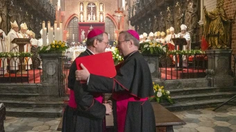 Archbishop Tadeusz Wojda of Gniezno, president of the Polish Bishops’ Conference (left), and Bishop Georg Bätzing, president of the German Bishops’ Conference, embrace after signing the joint declaration “Courage of Extended Hands” at the Cathedral of St. John the Baptist in Wrocław, Poland, on Tuesday, Nov. 18, 2025, during commemorations of the 60th anniversary of the historic correspondence between the Polish and German Bishops’ Conferences.