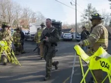  Connecticut State Police walk near the scene of an elementary school shooting on Dec. 14, 2012 in Newtown, Connecticut. 