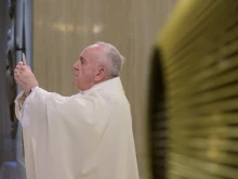 Pope Francis celebrates Mass in the chapel of the Casa Santa Marta April 18, 2020. 