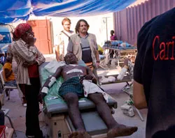 A patient receives medical treatment at a Caritas clinic in Port-au-Prince. ?w=200&h=150