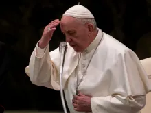 Pope Francis prays at his Wednesday general audience Feb. 13, 2019. 