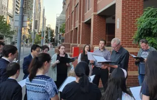 Carolers gather outside Melbourne Assessment Prison on Christmas Eve, 2019.   John Macauley/CNA
