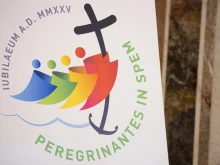 The logo of the 2025 Jubilee. The Vatican's Dicastery for Evangelization is organizing the Catholic Church's next Holy Year around the theme "Pilgrims of Hope."