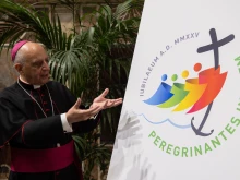 Archbishop Rino Fisichella, pro-prefect of the Dicastery for Evangelization, presents the logo for the 2025 Jubilee Year, June 28, 2022.