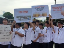 Students take part at a protest rally against corruption organized by the Catholic Church and others on Sept. 21, 2025.