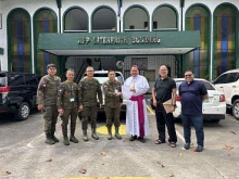 Bishop Elias Ayuban Jr. of Cubao hands over a letter of support to Armed Forces of the Philippines (AFP) Chief of Staff Romeo Brawner Jr. at Camp Aguinaldo, Manila on Nov. 14, 2025.