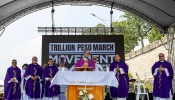 Cardinal Pablo Virgilio David with other bishops and clergy after celebrating Mass at the EDSA People Power Monument, Nov. 30, 2025, in Manila.