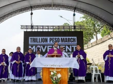 Cardinal Pablo Virgilio David with other bishops and clergy after celebrating Mass at the EDSA People Power Monument, Nov. 30, 2025, in Manila.