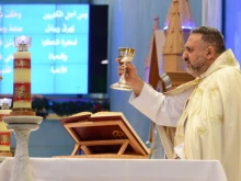 Father Charbel Mhanna offers Mass at Our Lady of the Rosary in Doha, Qatar.