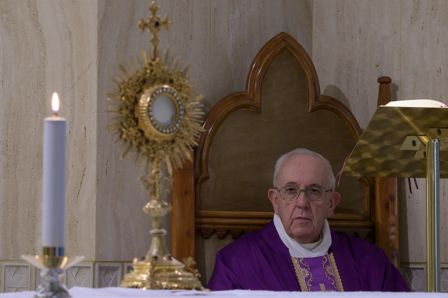 Pope Francis prays following Mass in Casa Santa Marta on March 23, 2020. ?w=200&h=150