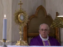 Pope Francis prays following Mass in Casa Santa Marta on March 23, 2020. 