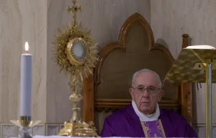 Pope Francis prays following Mass in Casa Santa Marta on March 23, 2020.   Vatican Media
