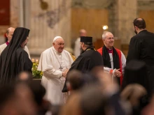 Pope Francis and Archbishop of Canterbury Justin Welby exchange greetings with other Christian leaders at an ecumenical second vespers at the Basilica of St. Paul Outside the Walls in Rome on the feast of the Conversion of St. Paul, Jan. 25, 2024.