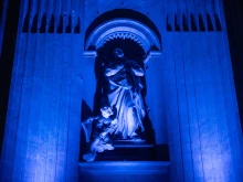 Statues illuminated in ethereal blue light during the special evening access to St. Peter's Basilica for the Jubilee of Artists, Feb. 16, 2025.