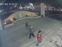 Photo taken from surveillance footage shows suspect (center) with two other individuals just prior to a vandalism incident at Holy Family Catholic Church in Jacksonville, Florida, on Feb. 23, 2022.