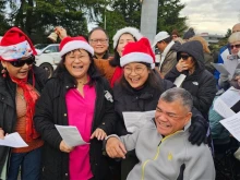Carolers outside Planned Parenthood in Aurora, Illinois, on Dec. 13, 2025.