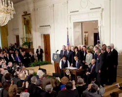 President Obama signs the health care overhaul into law. ?w=200&h=150
