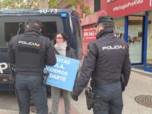A 40 Days for Life volunteer tries to pray for the end of abortion in Madrid in front of the police present on Dec. 28, 2023.