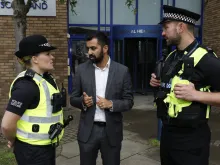 Humza Yousef, Scottish Justice Secretary, speaks with police officers, August 2018. 
