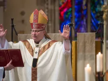 Archbishop John Wilson of Southwark says Mass at St. George's Cathedral, Southwark. 