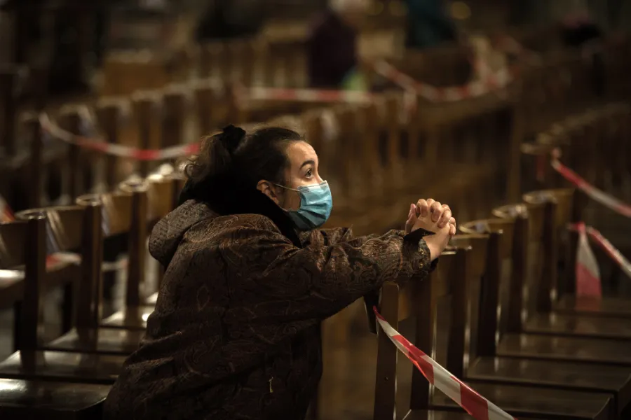 A woman prays in Westminster Cathedral, London, Nov. 4, 2020, the day before a four-week lockdown in England. ?w=200&h=150