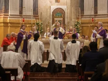 Cardinal Gerhard Müller (center) and Father Joseph Hamilton (at left), personal secretary to the late Cardinal George Pell, were among the priests celebrating the Jan. 10, 2024, Mass held on the first anniversary of the cardinal's death.