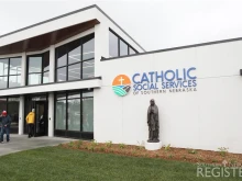 The statue of the Blessed Mother pictured before the incident on its pedestal in front of the headquarters of Catholic Social Services of Southern Nebraska.
