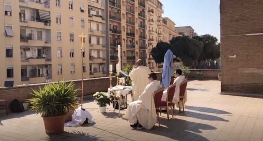 Fr. Carlo Purgatorio celebrates the rooftop Mass in Rome. ?w=200&h=150