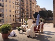 Fr. Carlo Purgatorio celebrates the rooftop Mass in Rome. 
