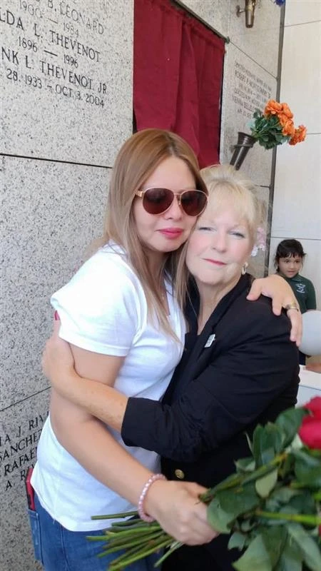 Lise Naccari (right) embraces a grieving mother at a burial at the crypt at St. Patrick’s Cemetery in New Orleans. Credit: Photo courtesy of Compassionate Burials for Indigent Babies