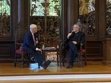 Winona-Rochester Bishop Robert Barron, with Deacon Tim O'Donnell to his left, answers questions from the crowd following his lecture "The Catholic Intellectual Tradition" on Harvard University's campus on Sept. 17, 2023.